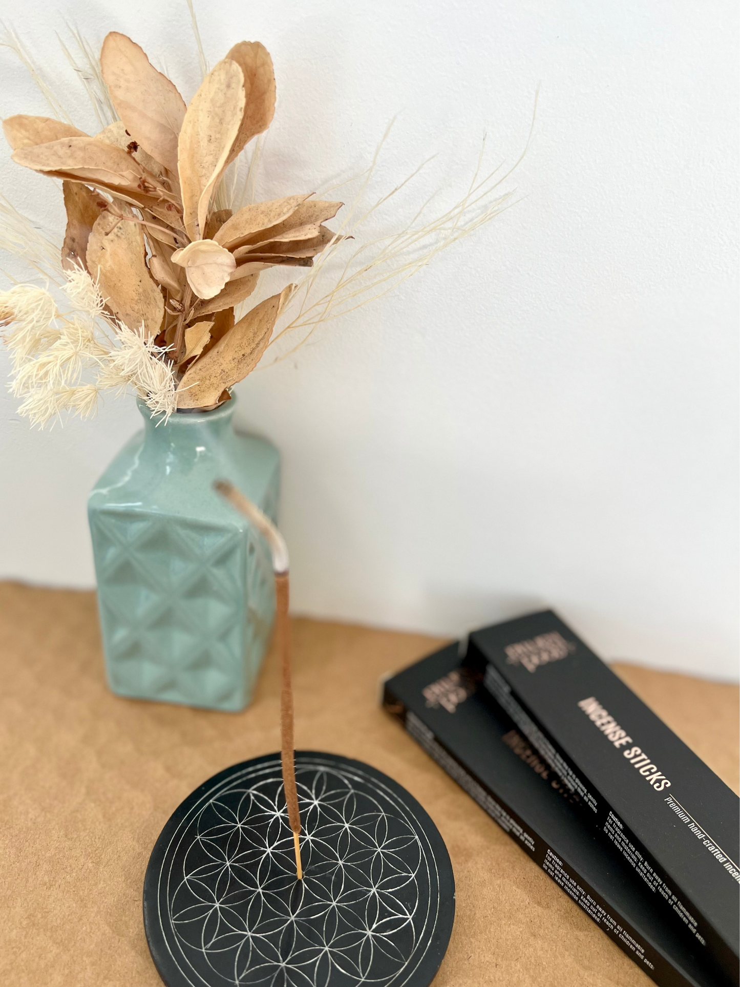 Good Karma Handcrafted incense sticks packs with Incense burning on Incense sticks holder and vase