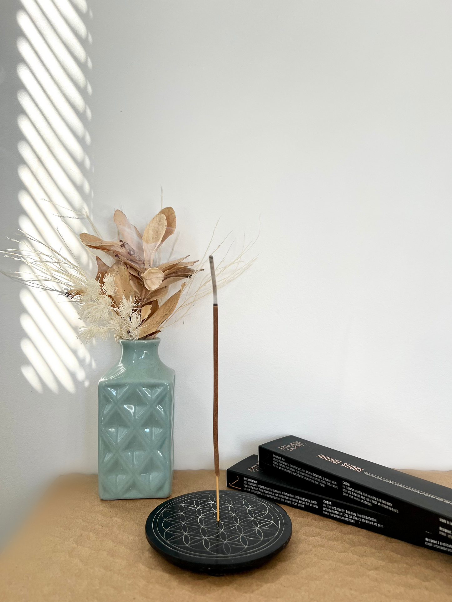 Good Karma Handcrafted incense sticks packs with Incense burning on Incense sticks holder and vase