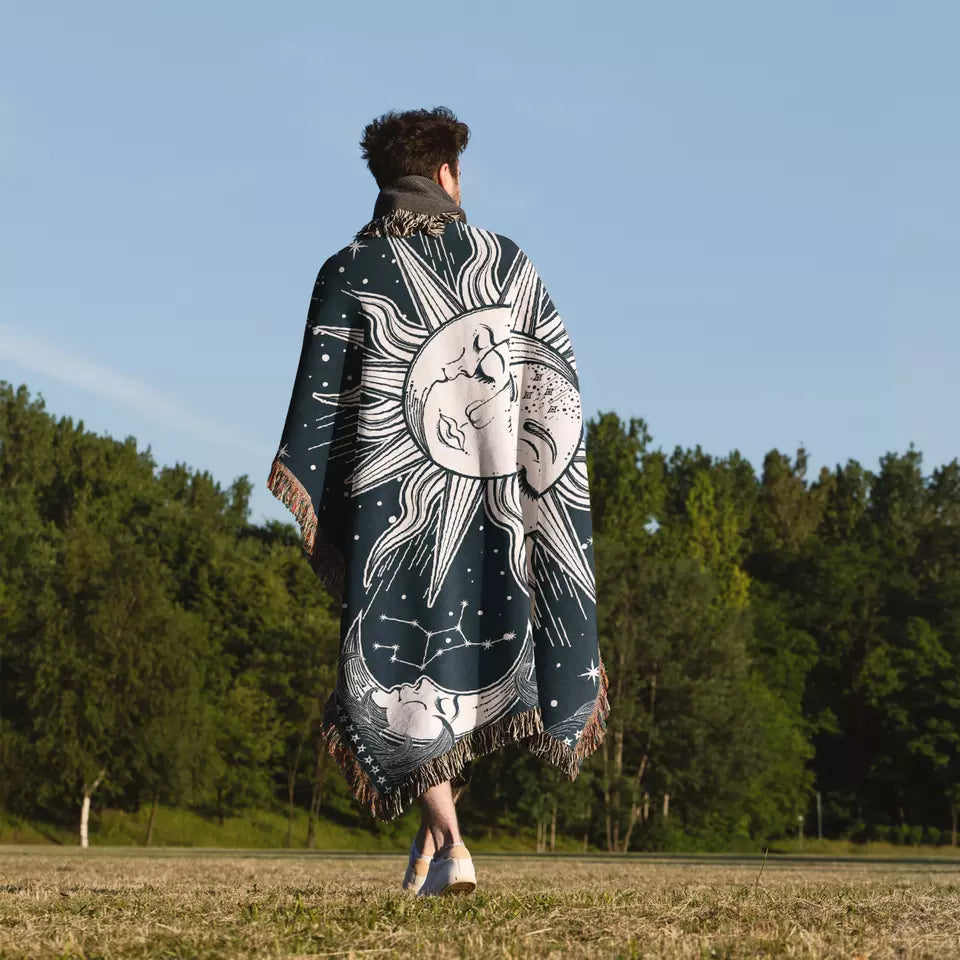 sun and moon and star sky pattern boho throw with tassels on the man
