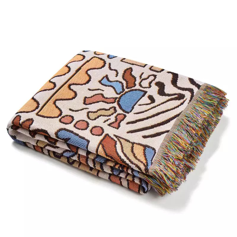 Colorful pattern gypsy style hippie style Woven Boho Quilt Colorful Bohemian Tapestries with tassels folded on white background
