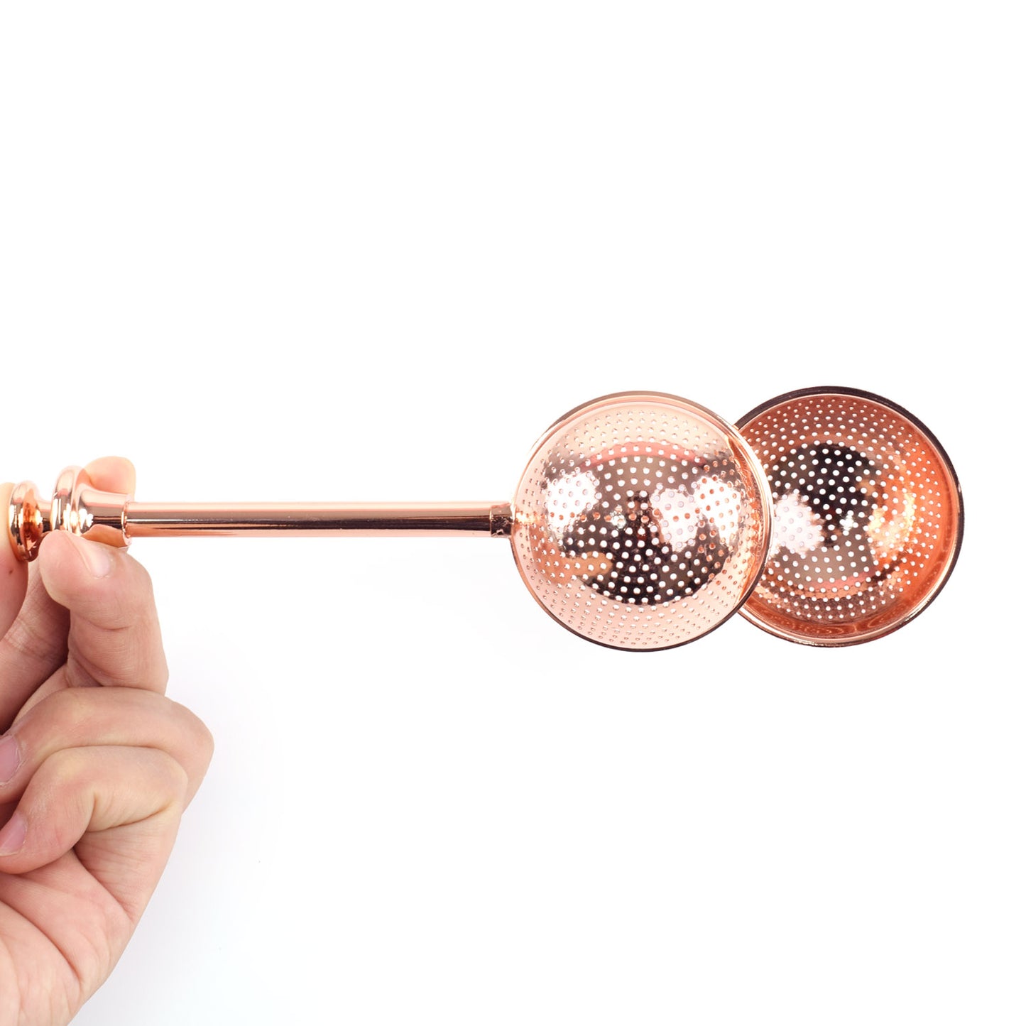 Good Karma tea infuser ball is 2-in-1 scoop and a strainer rose gold color open in hand