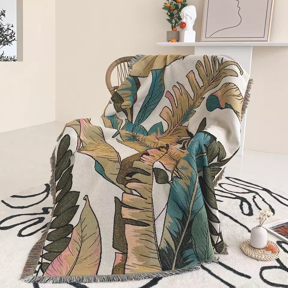 Woven Bohemian Quilt with Big Green Leaves pattern Large boho tapestry with tassels, on the corner Boho Quilt Colorful Bohemian Tapestries with tassels covering the chair