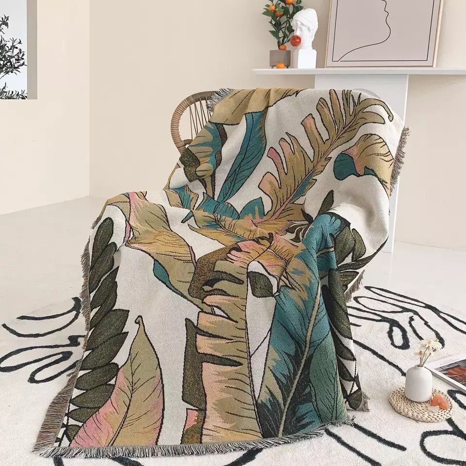  Woven Bohemian Quilt with Big Green Leaves pattern Large boho tapestry with tassels, on the corner  Boho Quilt Colorful Bohemian Tapestries with tassels covering the chair 