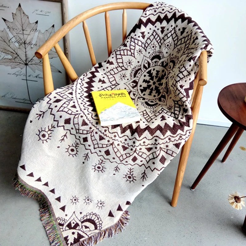 Woven Bohemian Quilt with Colorful Nordic pattern Large boho tapestry with tassels, on the corner Boho Quilt Colorful Bohemian Tapestries with tassels on the wooden chair