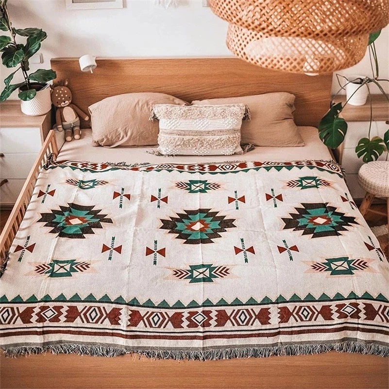 Aztec pattern Woven Boho Quilt Colorful Bohemian Tapestries with tassels like a boho blanket on the bed