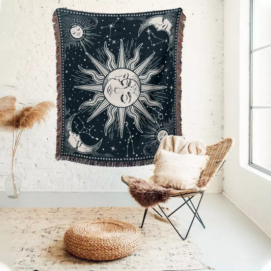 sun and moon and star sky pattern tapestries with tassels on the white wall 