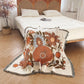 Floral Boho throw nz, orange and brown Floral pattern Woven Boho Quilt nz Colorful Bohemian Tapestries with tassels on white background laydown on the bed with white bedsheets